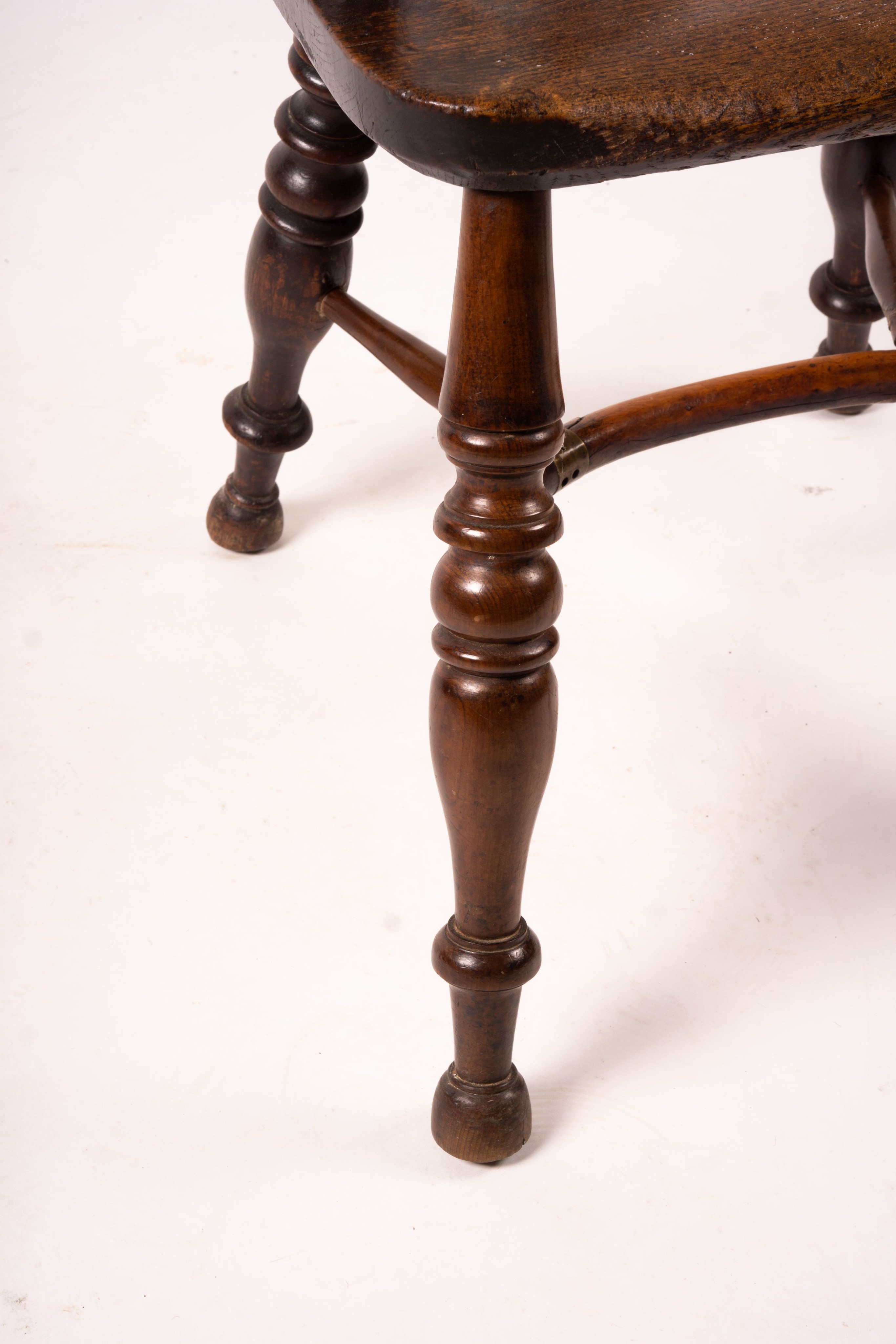 A 19th century yew and elm Yorkshire area Windsor elbow chair with crinoline stretcher, width 60cm, depth 45cm, height 93cm